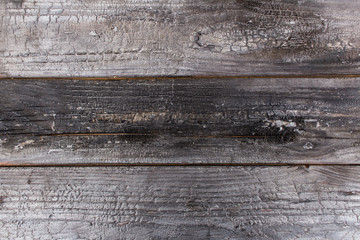 Burnt wood boards background.