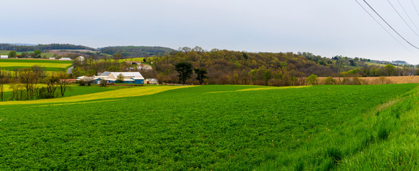 Pennsylvania countryside and farms in spring near Kutztown. Fields just starting to be plowed.