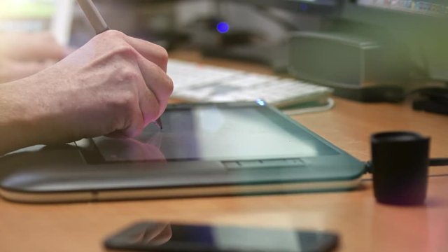 Graphic Designer working with digital Drawing tablet