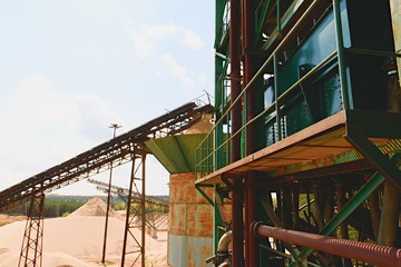 Quarry aggregate and conveyor belts. Construction industry. Horizontal  photo.