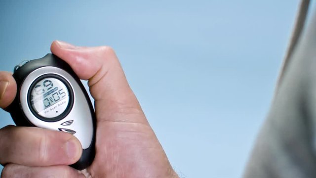 Close ups Of Different Stop Watches in man hand - 1