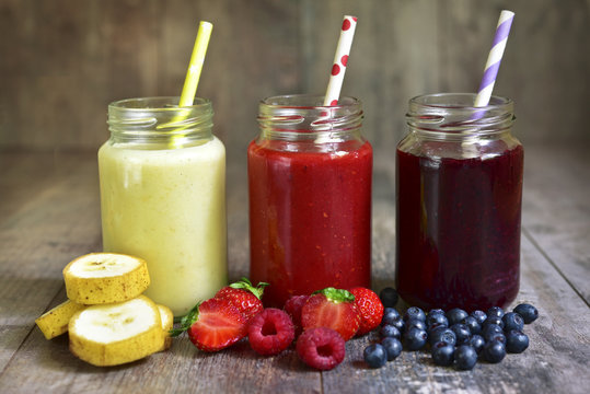 Three portions of different smoothies.