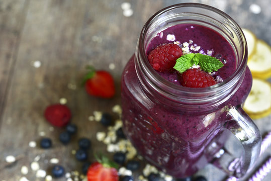 Blueberry smoothie in a mason jar .