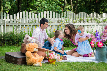 A couple sitting with the children