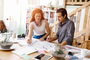 Two young architects in office