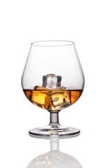 Glass of strong alcoholic drink scotch whiskey with ice cube