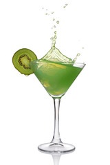 Splash in glass of green mint alcoholic cocktail drink with kiwi