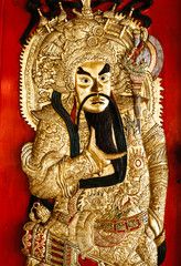 Carving wood of Chinese god on the door