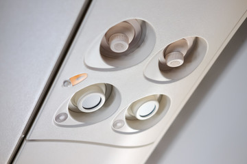 Airplane overhead console with air conditioning and lighting