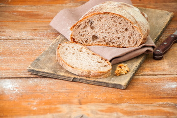 Freshly baked homemade artisan sourdough rye and white flour bread. Sliced. Top view. Copy space.