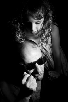 Father and daughter in gang style, dark light