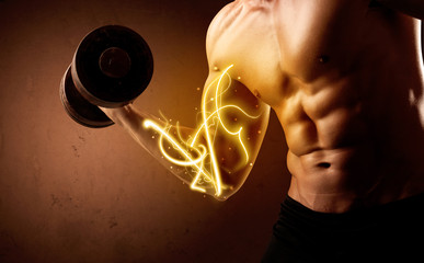 Muscular body builder lifting weight with energy lights on biceps