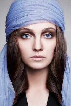 A beautiful woman in a shawl 
