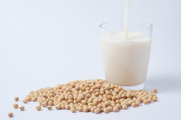 Soy milk and soy beans on white background. healthy and  nutrition life style.