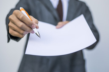 Business man give white paper for sign