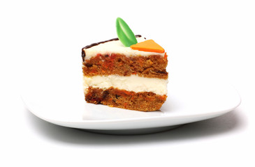 A piece of carrot pie on a plate on a white background