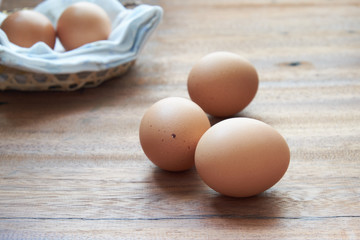 Eggs lay on wooden background. Food ingredient.