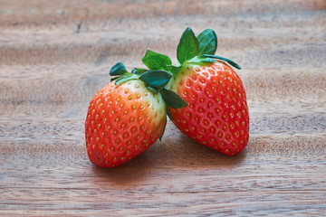 Fresh strawberries close-up on wooden background.