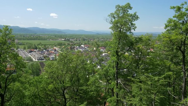 The views of the European modern village near an old town in a natural forested area, aerial, 4K - 1