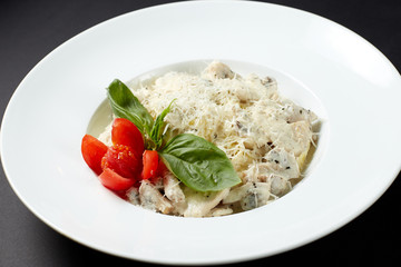 Fettuccine with chicken and mushrooms. Italian style. Italian food. Italian cuisine.