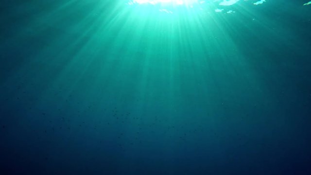 Underwater GoPro shots, sun rays through the water, splashes and bubles
