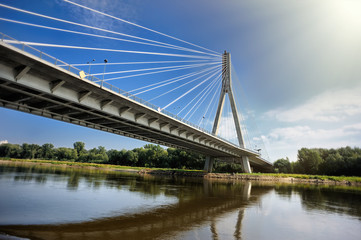 Modern Swietokrzyski bridge in Warsaw over Vistula river, Poland