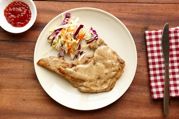 Pork chops steak hot grilled with salad Top view, lunch  or dinner favorite dish.