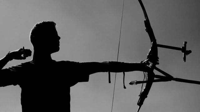 Target Archery: Young Archer Backlight, Practice in Field, Slow Motion