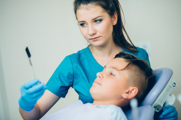 X-rays of the teeth of the patient. Dentist shows a patient x-rays of the teeth in the dental office