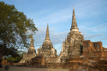 Three ancient stupas of the Buddhist temple of Wat Phra Si Sanphet on a cloudy morning. Ayutthaya,...