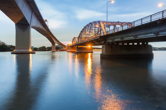 Fototapeta New and Old bridge cross over Bangkok city river, cityscape background
