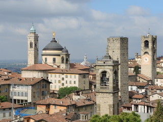 Fototapeta premium Bergamo - Old city (Città Alta), Italy. Landscape on the city center, the old towers and the clock towers from the old fortress