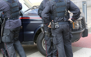 policeman in riot gear during a roadblock to control in national