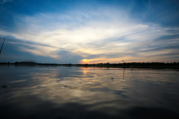 Obraz na płótnie Canvas Beautiful sunset on the lake shore