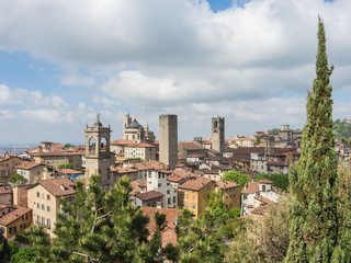 Fototapeta na wymiar Bergamo - Old city (Città Alta), Italy. Landscape on the city center, the old towers and the clock towers from the old fortress
