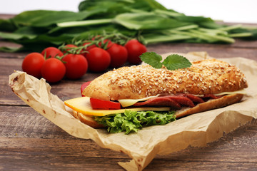 Delicious salami cheese and ham baguettes with fresh lettuce