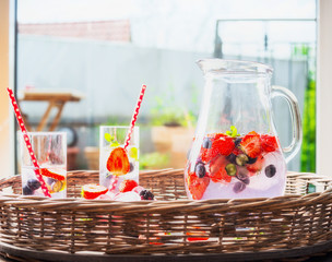 Berries Water,  beverage in glass jug, front view