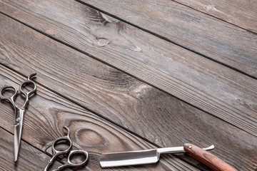 Vintage barber shop tools on wooden background