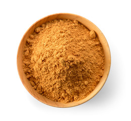 Cinnamon Powder in wood spoon on white background