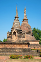 Two ancient chedi of Buddhist temple Wat Sa Si. Sukhothai Park, Thailand