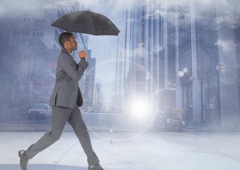 Fototapeta na wymiar Businessman walking with umbrella in city