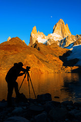 Silhouette of the photographer, at Mount Fitz Roy at dawn. Argentine Patagonia.