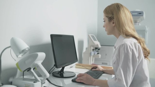 Female Doctor Working With Computer