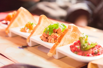 four small European salad appetizers