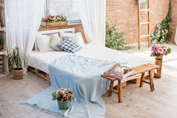 Design bedroom in loft style and Provence, bed from the pallet