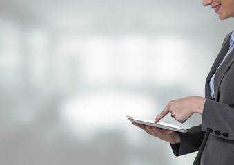 Obraz premium Woman touching tablet with bright background