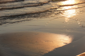 Waves beat against beach at sunset, St Kilda's Beach, Australia