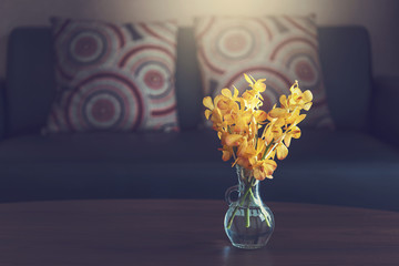 Yellow orchid flower vase decoration interior of room