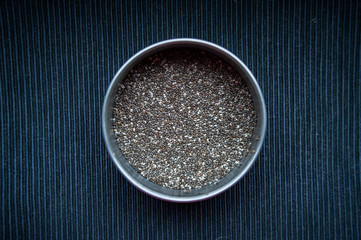 Chia seeds in a round tin can macro