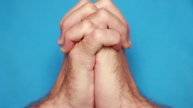 Prayer connected his hands closeup